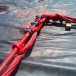 American Iron Works flow back red iron sling securing 1502 piping restraint